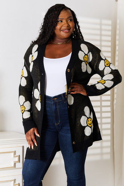 Black Perfee floral longline button-down cardigan by Trendsi, featuring a relaxed fit and floral pattern, on a model.