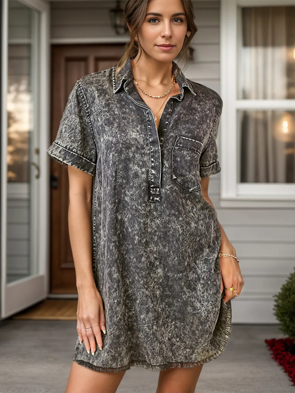 Black denim dress with a collared neckline, short sleeves, and front pockets, by Trendsi.