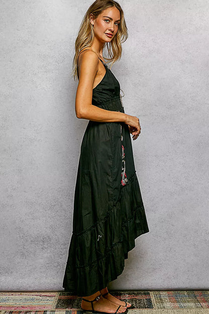 Black POL embroidered tassel tie smocked waist midi tiered cami dress by Trendsi, featuring embroidered details and tassel accents.
