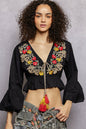 Black floral embroidered cropped blouse from Trendsi, featuring detailed embroidery and a stylish, feminine design.