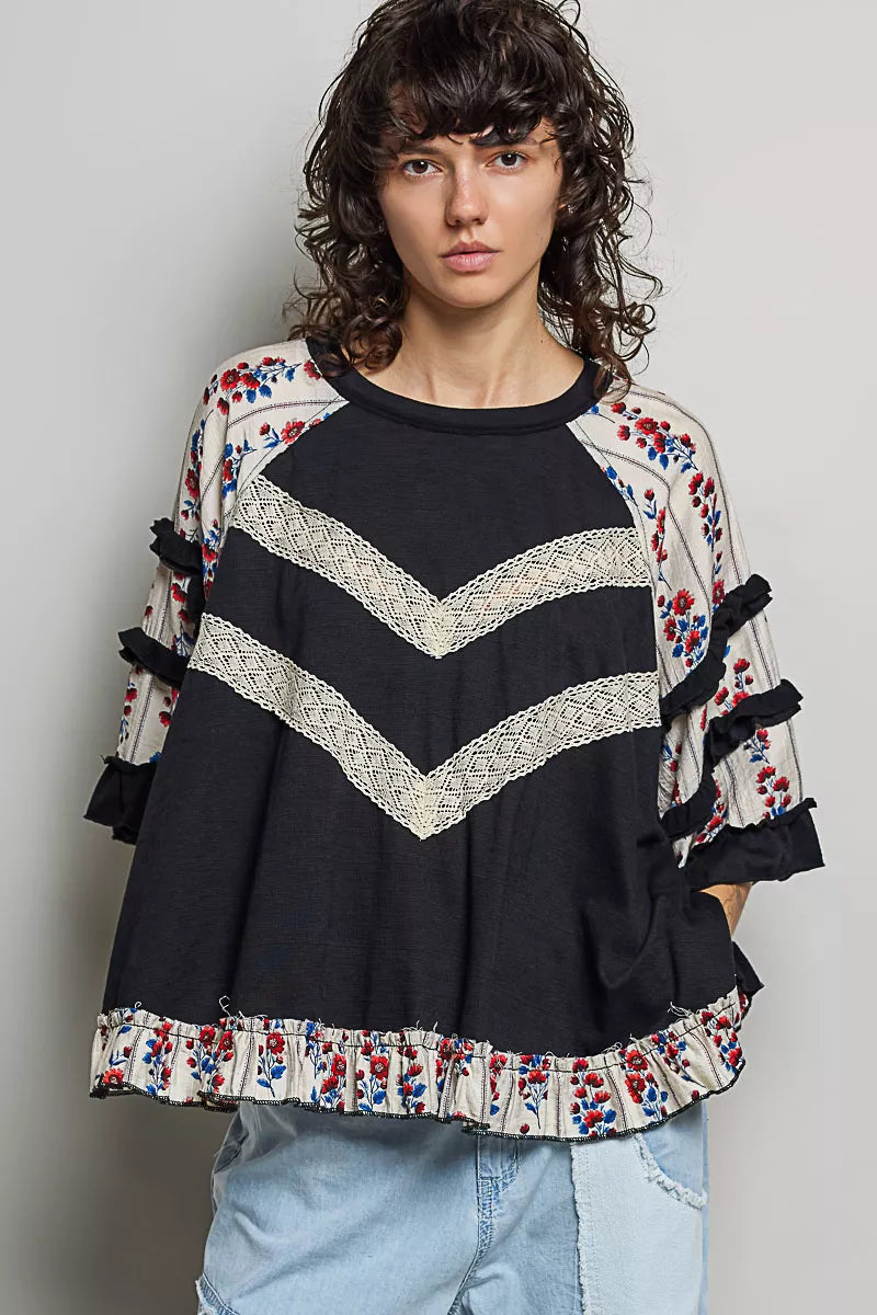 Black oversized knit top with round neck, half sleeves, contrast floral lace details, by Trendsi.