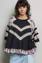 Black oversized knit top with round neck, half sleeves, contrast floral lace details, by Trendsi.