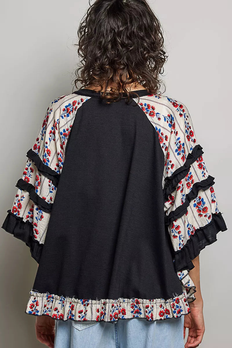 Black oversized knit top with round neck, half sleeves, contrast floral lace accents, by Trendsi.