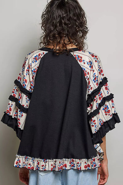 Black oversized knit top with round neck, half sleeves, contrast floral lace accents, by Trendsi.