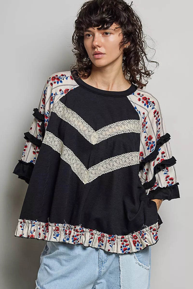 Black oversized knit top with round neck, half sleeves, contrast floral lace details, by Trendsi.