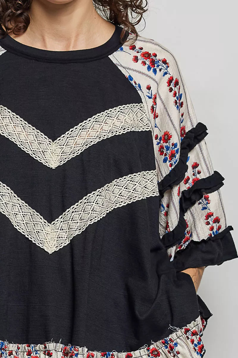 Black oversized knit top with round neck, half sleeves, floral lace contrast, by Trendsi.