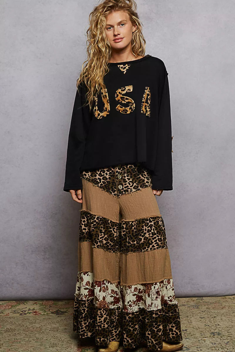 Black POL round neck long sleeve French terry sweatshirt from Trendsi featuring USA letter and animal patch detail.