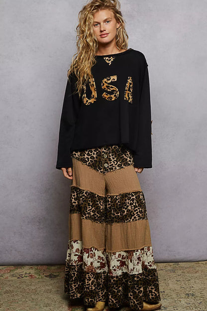 Black POL round neck long sleeve French terry sweatshirt from Trendsi featuring USA letter and animal patch detail.