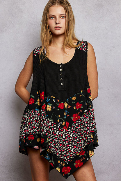 Black POL round neck ribbed tank top with woven print patch from Trendsi, showcasing the textured fabric and stylish patch detail.