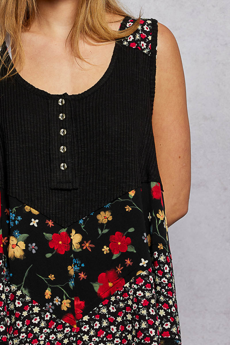 Black POL round neck ribbed tank top with woven print patch from Trendsi, featuring a fitted sleeveless design and textured fabric.