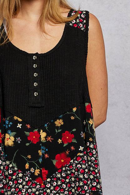 Black POL round neck ribbed tank top with woven print patch from Trendsi, featuring a fitted sleeveless design and textured fabric.