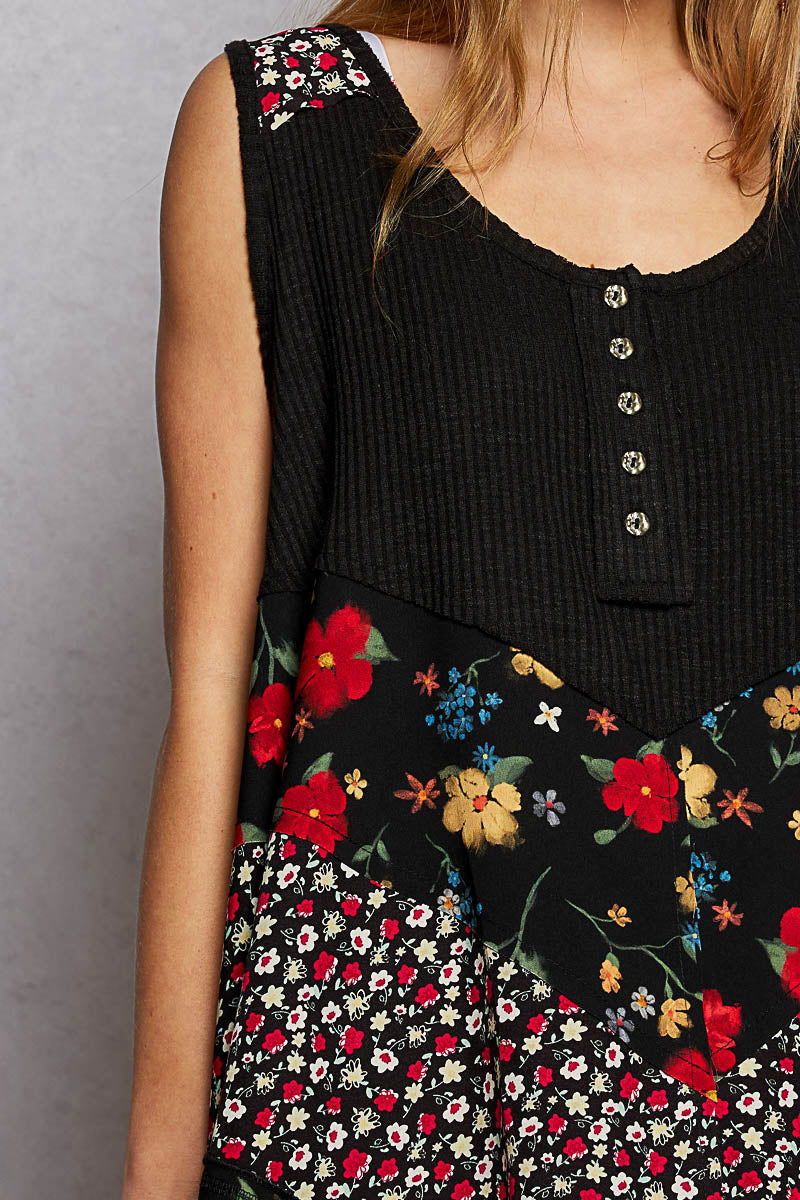 Black POL round neck ribbed tank top with woven print patch from Trendsi, close-up showing fabric texture and design details.