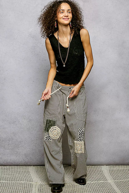 Black POL textured knit V-neck tank top with lace trim, stylish and comfortable women's sleeveless knit blouse.