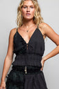 Black POL V-neck cotton ruffled crop cami by Trendsi showing the front view with ruffled details and V-neck design.