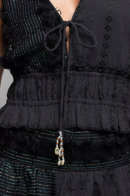 Black POL V-neck cotton ruffled crop cami by Trendsi, featuring a fitted V-neck design and delicate ruffled details.