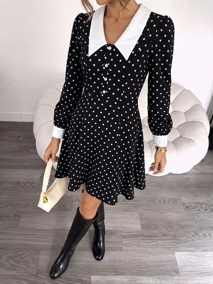 Black polka dot Peter Pan collar dress by Trendsi featuring a classic fit and elegant design, perfect for casual or semi-formal occasions.