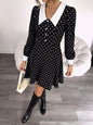 Black polka dot Peter Pan collar dress by Trendsi featuring a classic fit and elegant design, perfect for casual or semi-formal occasions.