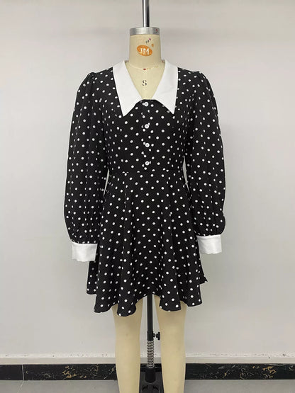 Black polka dot Peter Pan collar dress by Trendsi featuring a cute, classic design with short sleeves and a fitted waist.