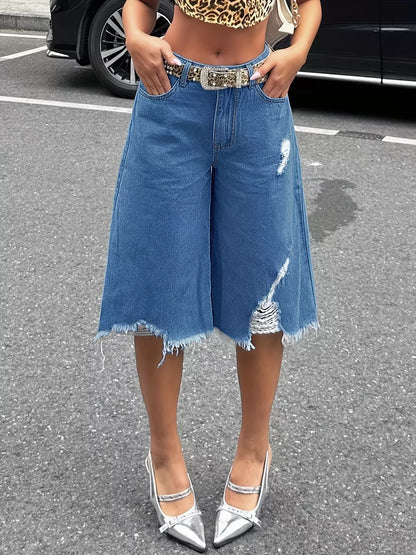 Black raw hem distressed denim shorts by Trendsi, featuring frayed edges and a casual fit, shown on a model.