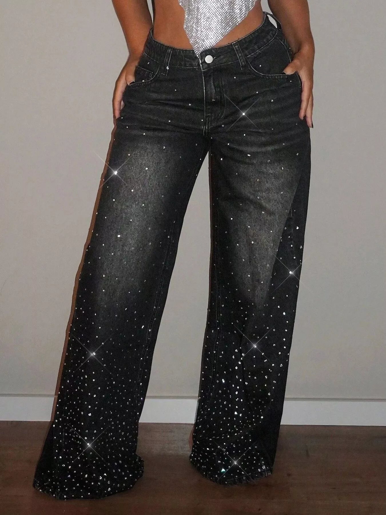 Black rhinestone wide-leg jeans by Trendsi featuring embellished rhinestones along the waistband and flowing wide-leg fit.