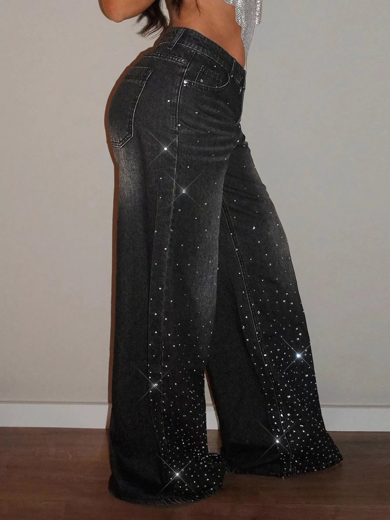 Black rhinestone wide-leg jeans by Trendsi featuring rhinestone embellishments and a relaxed fit.