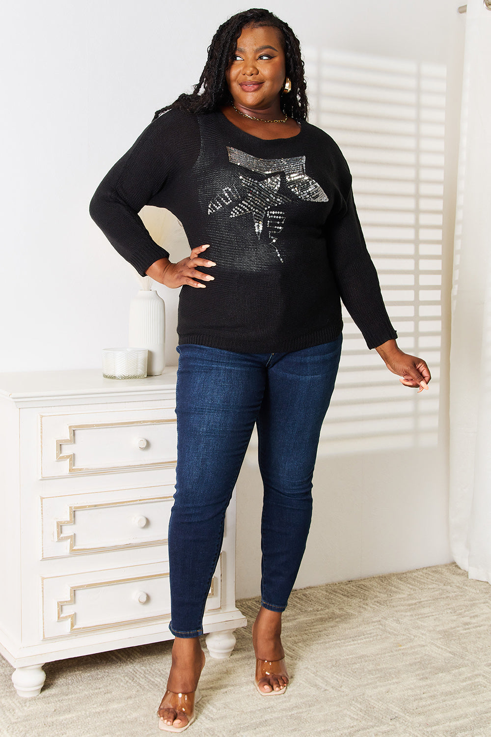 Black sequin graphic dolman sleeve knit top by Trendsi, featuring a relaxed fit and eye-catching sequin design on the front.