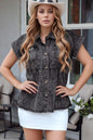 Black short sleeve denim shirt by Trendsi with flap pockets, button-up front, and raw hem for a casual, stylish look.