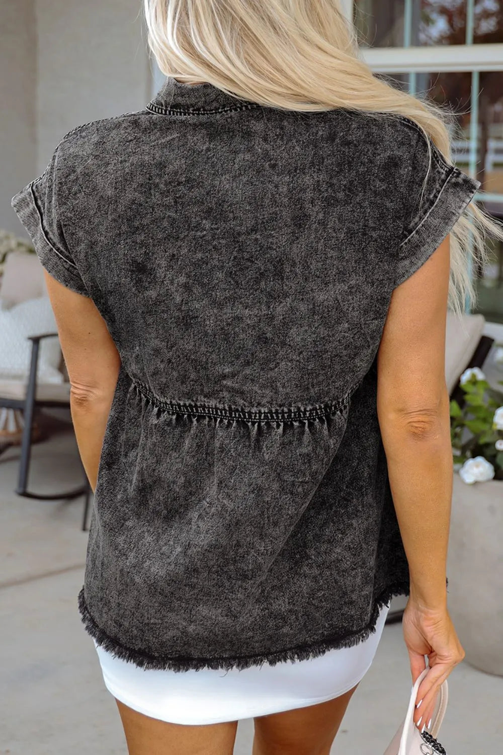 Black short sleeve denim shirt with flap pockets, button-up front, and raw hem from Trendsi.