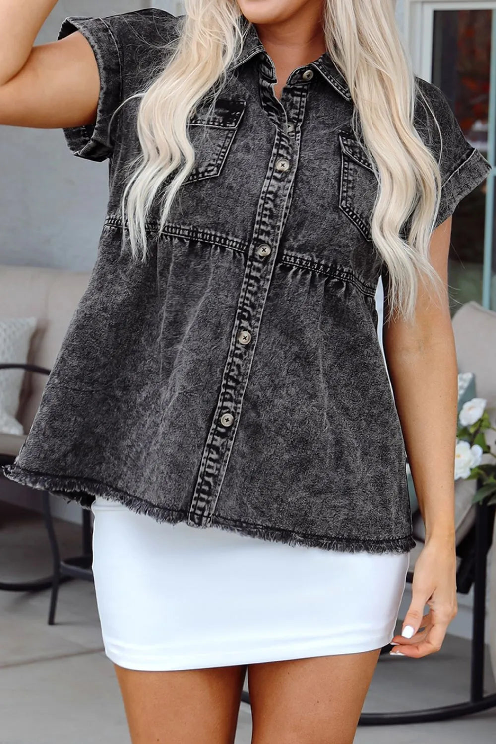 Black short sleeve denim shirt with flap pockets, button-up front, and raw hem from Trendsi.