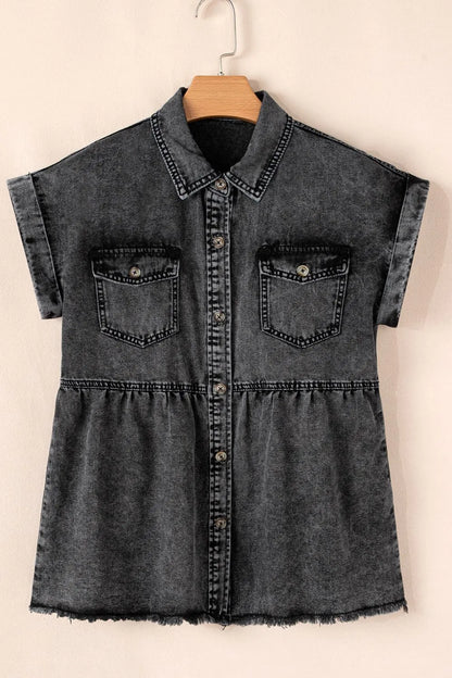 Black short sleeve denim shirt with flap pockets, button-up front, and raw hem from Trendsi displayed on a model.