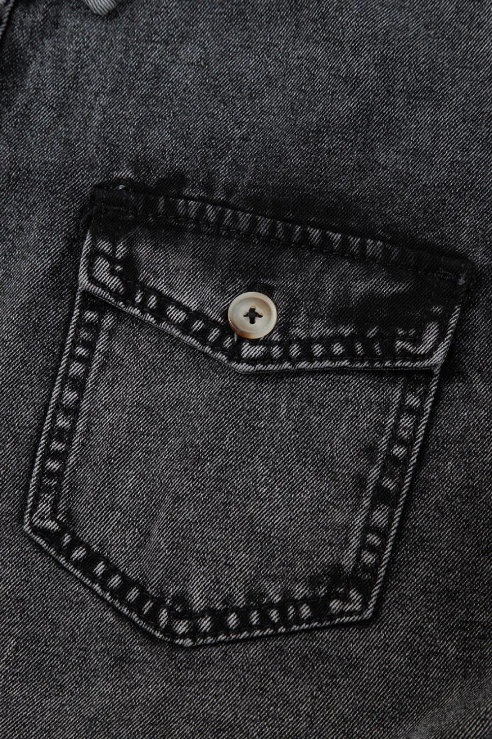 Black short sleeve denim shirt by Trendsi with flap pockets, button-up front, and raw hem for a casual, stylish look.