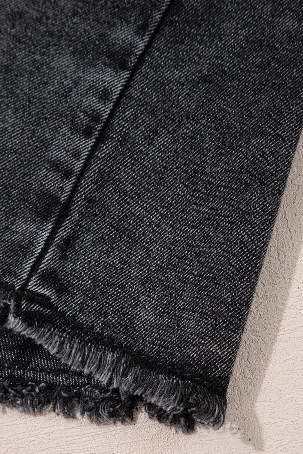 Black short sleeve denim shirt with flap pockets, button-up front, and raw hem from Trendsi, casual and stylish for everyday wear.