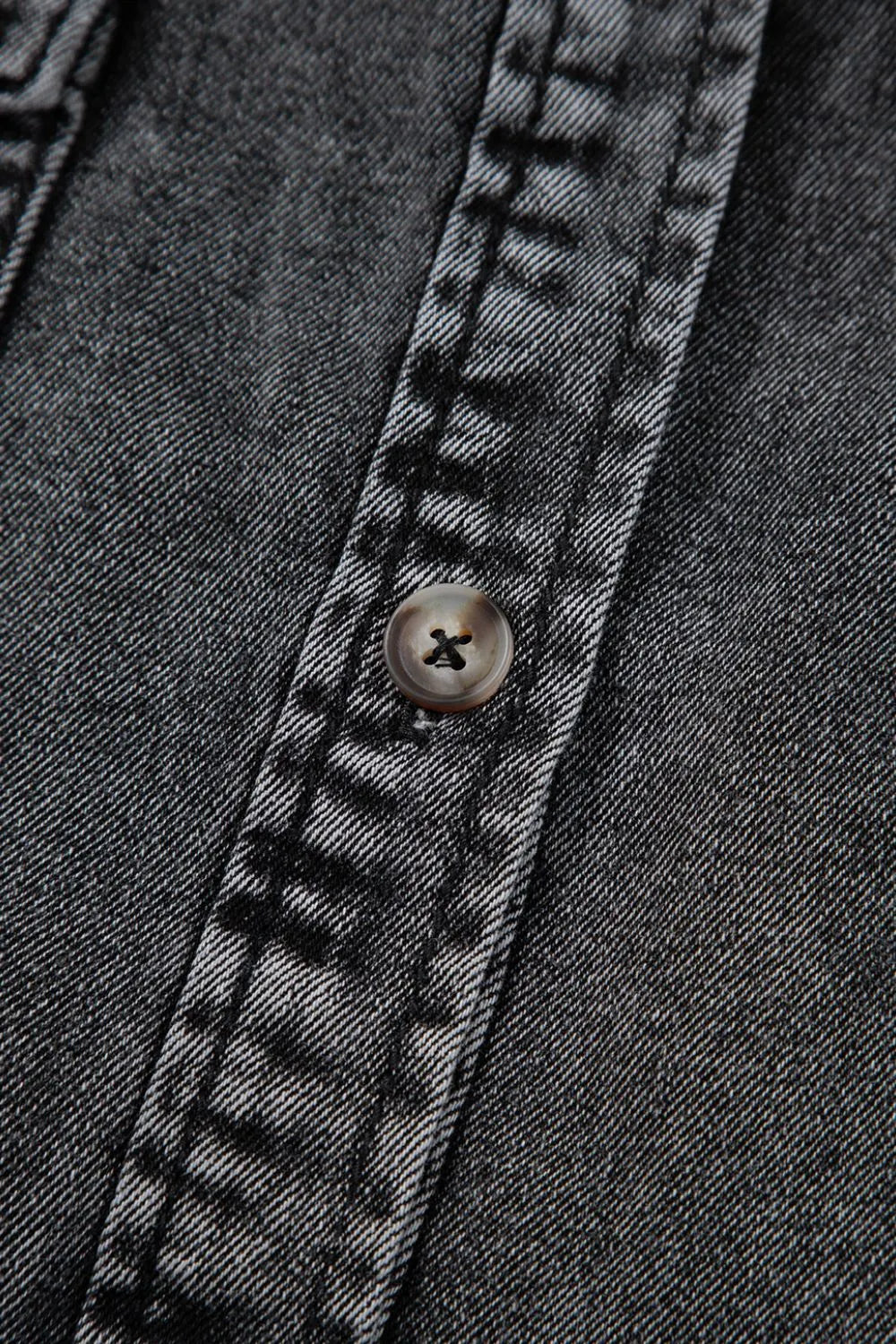 Black short sleeve denim shirt with flap pockets, button-up front, and raw hem from Trendsi.