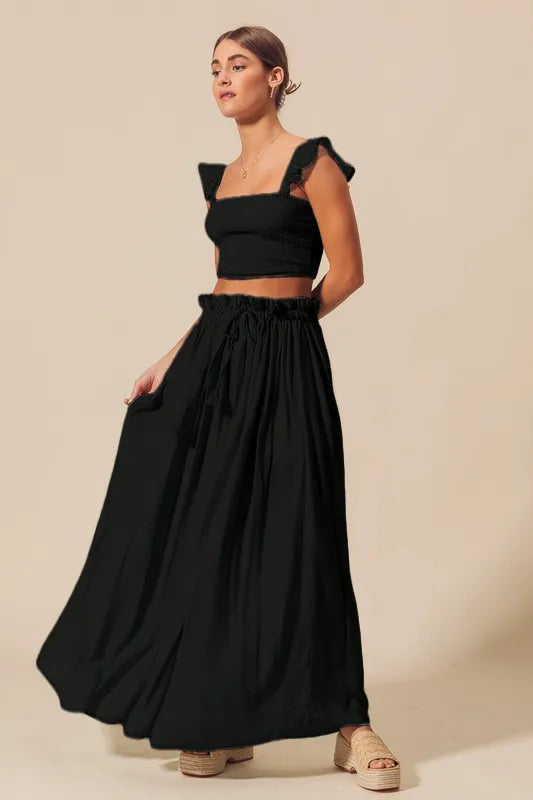 Trendsi black smocked top and flowy maxi skirt set, stylish two-piece outfit with comfortable fit and elegant design.