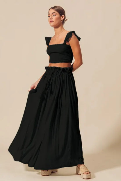 Trendsi black smocked top and flowy maxi skirt set, stylish two-piece outfit with comfortable fit and elegant design.