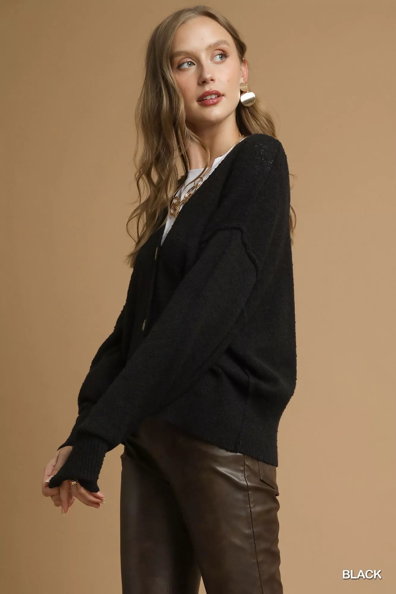 Black Umgee button-front V-neck knit cardigan with long sleeves and ribbed details, casual and cozy for layered outfits.