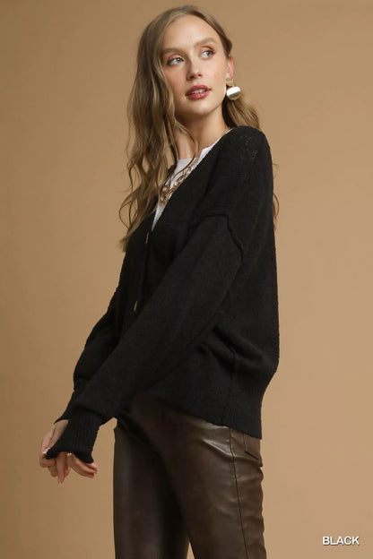 Black Umgee button-front V-neck knit cardigan with long sleeves and ribbed details, casual and cozy for layered outfits.
