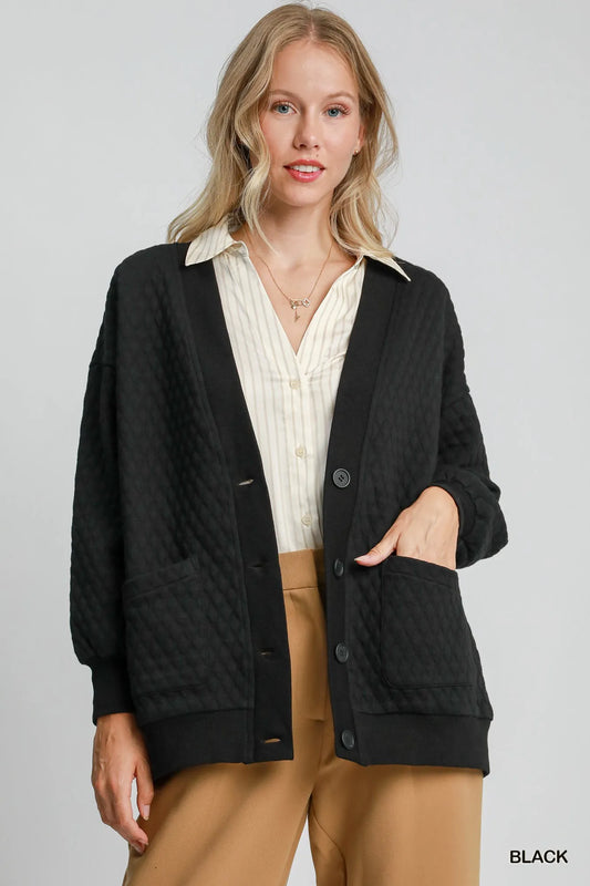 Black Umgee button-up jacquard cardigan with intricate woven pattern, styled for a cozy, fashionable look.