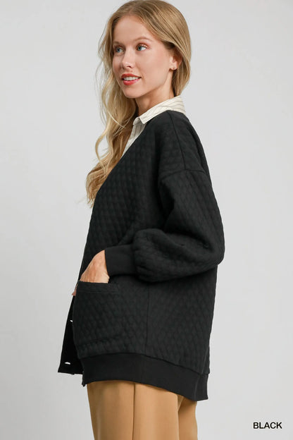 Black Umgee button-up jacquard cardigan with intricate woven pattern, long sleeves, and front buttons, casual and stylish for layering.