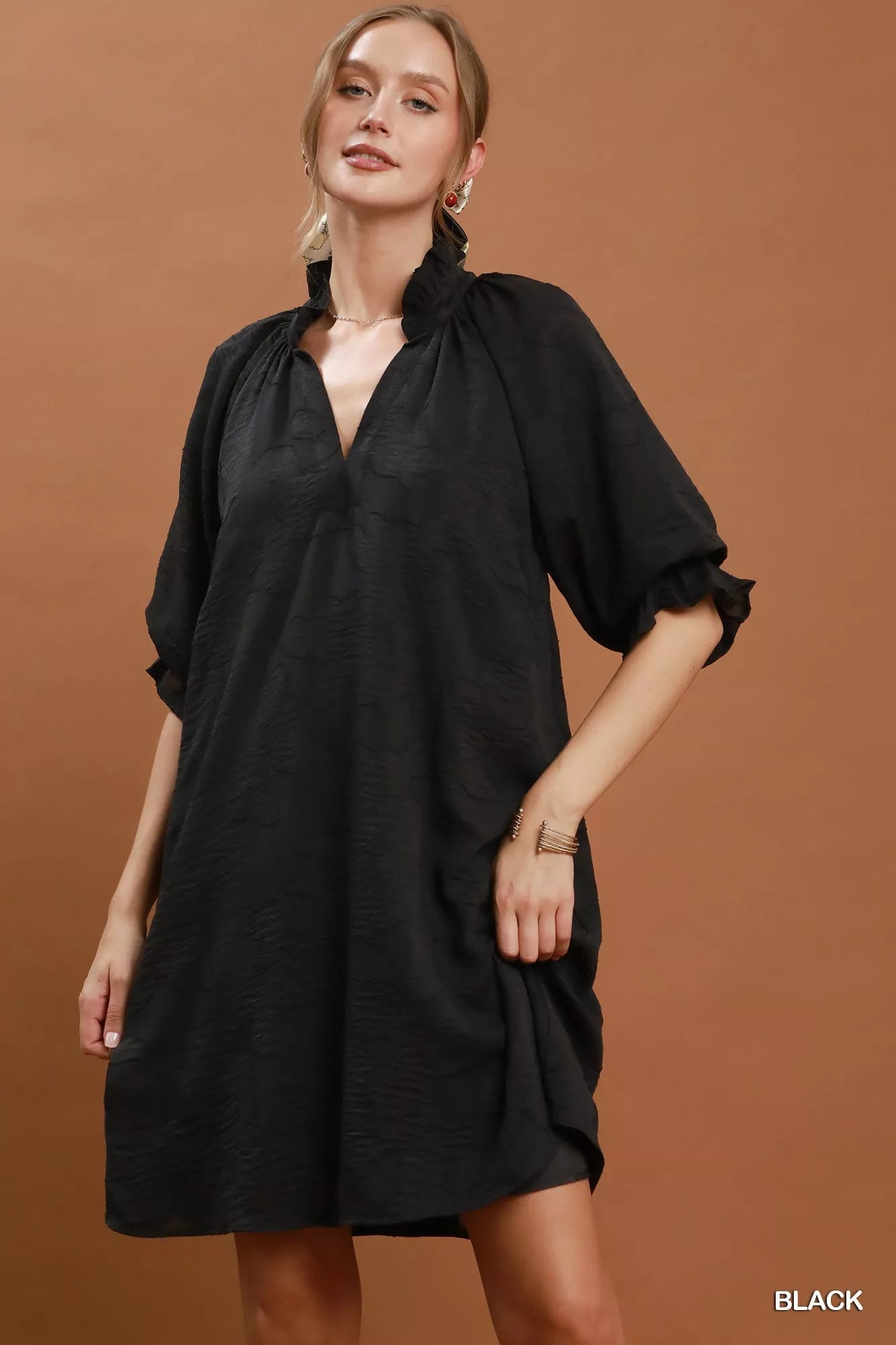Black Umgee floral textured jacquard V-neck dress with a fitted silhouette, featuring intricate floral pattern and stylish design.