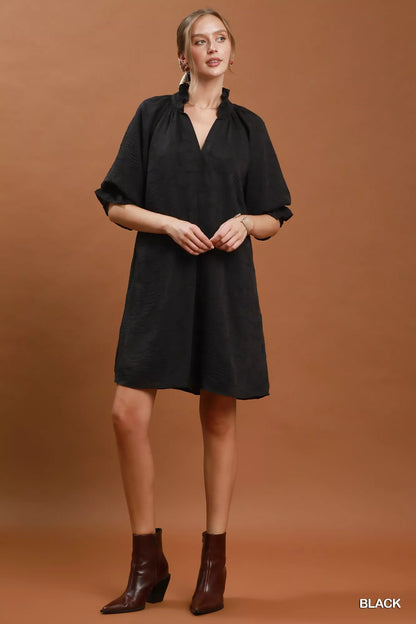 Black Umgee floral textured jacquard V-neck dress with long sleeves and a fitted silhouette, perfect for casual or dressy occasions.