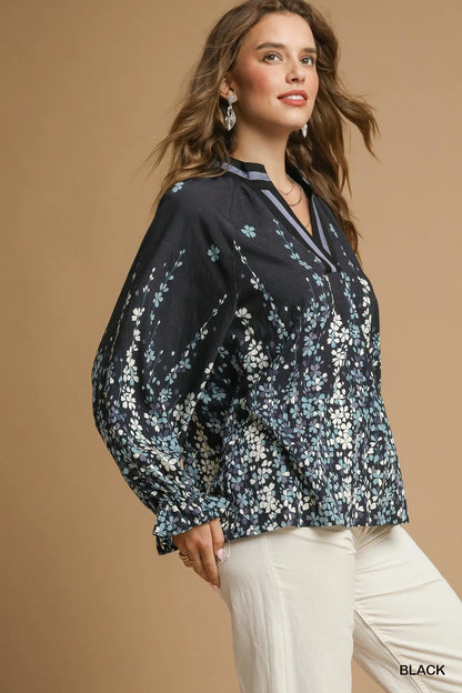 Plus size Umgee floral vine print blouse with balloon sleeves, featuring a full-size fit in black from Trendsi.