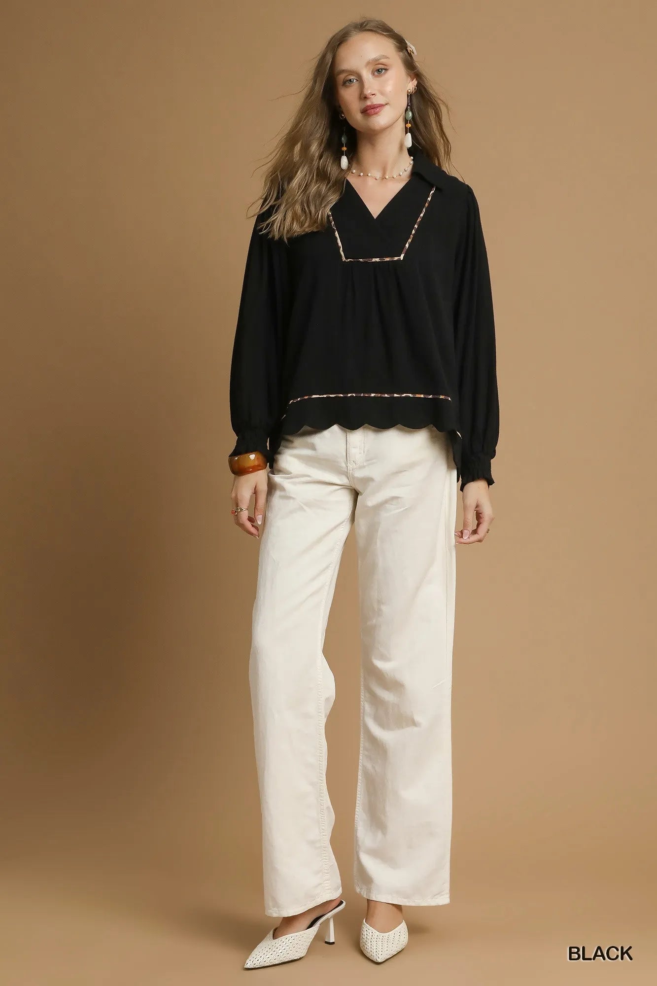 Plus size black linen blouse by Umgee with scallop hem and contrast trim, featuring a relaxed fit and stylish details.