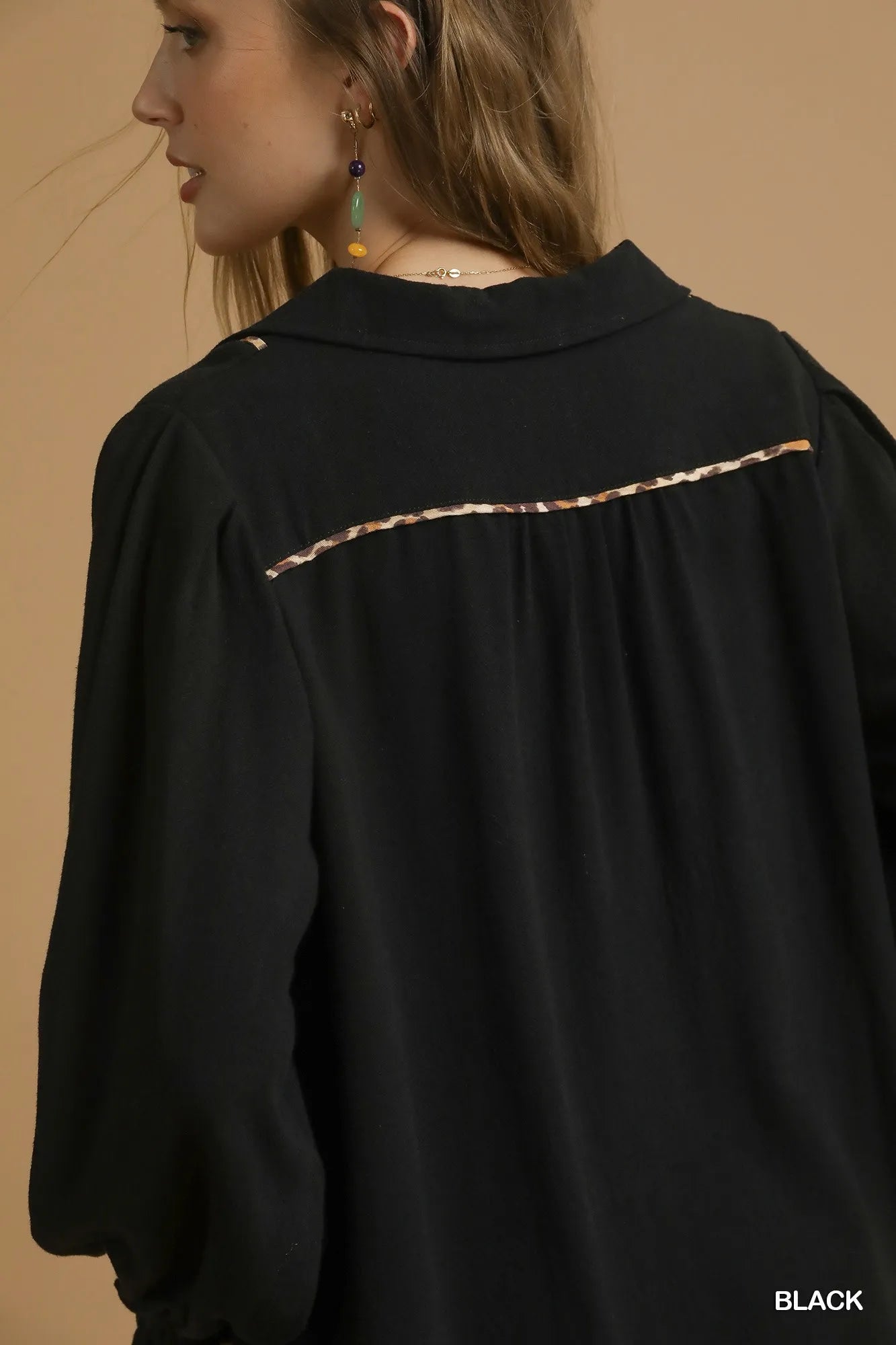 Black plus size linen blouse with scallop hem and contrast trim from Umgee, styled with long sleeves and relaxed fit.