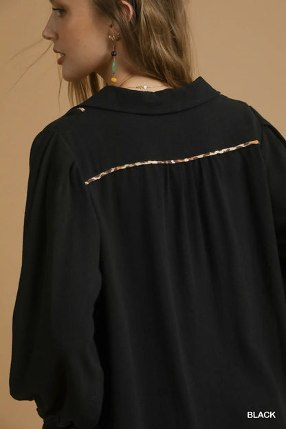 Black plus size linen blouse with scallop hem and contrast trim from Umgee, styled with long sleeves and relaxed fit.
