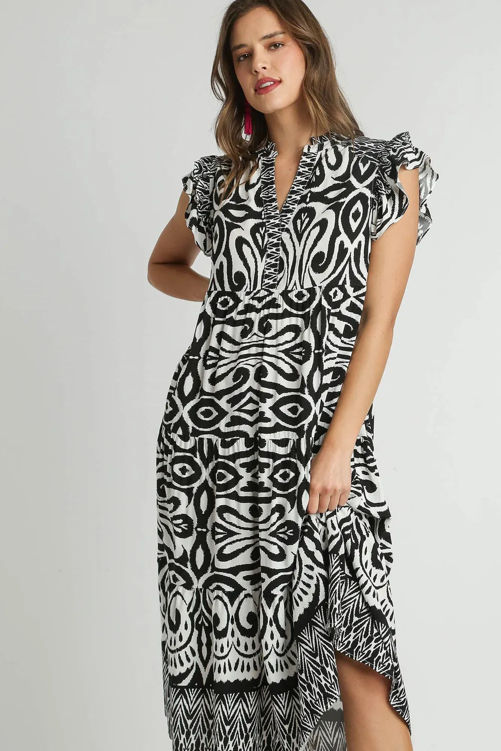 Plus size black Umgee midi dress with two-tone border print, ruffle cap sleeves, and a stylish, feminine design.