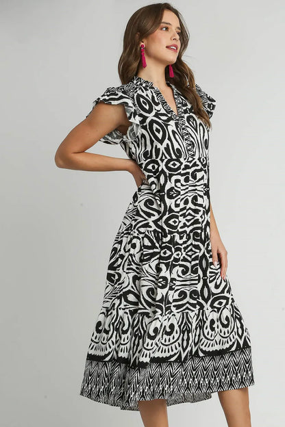 Plus size Umgee midi dress with two-tone border print, ruffle cap sleeves, and a stylish, comfortable fit.