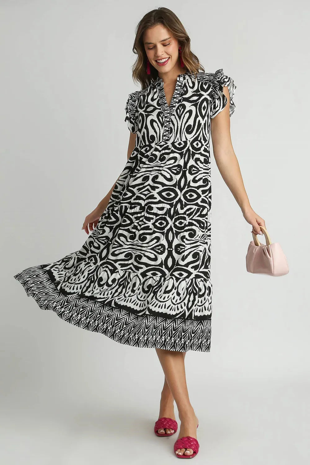 Plus size Umgee midi dress with two-tone border print, ruffle cap sleeves, in black, showcasing a stylish, flowy design.