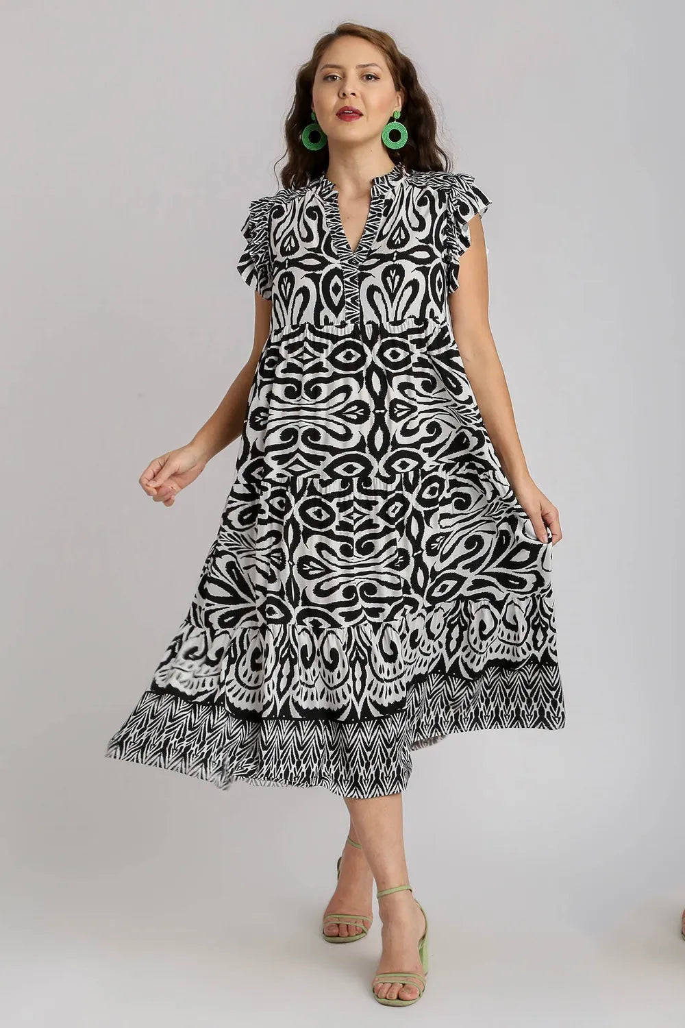 Plus size Umgee midi dress with two-tone border print, ruffle cap sleeves, and a stylish, flowy silhouette.