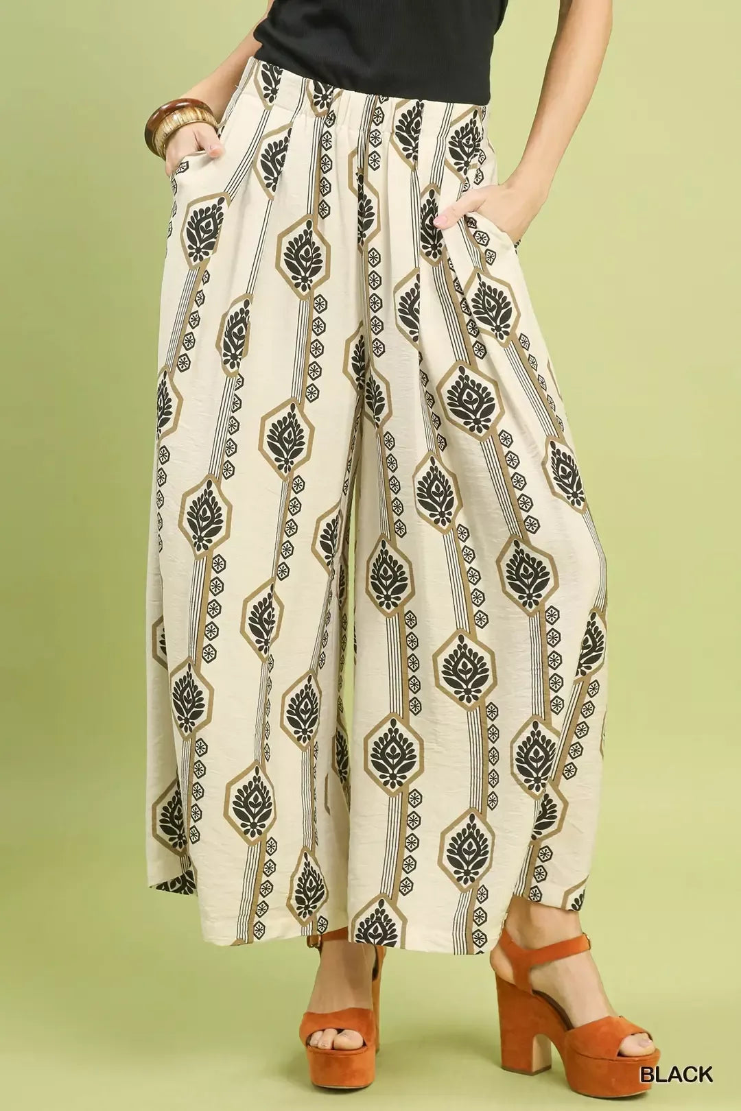 Black Umgee geometric boho print wide-leg pants with a relaxed fit, featuring bold patterns and a comfortable, flowing silhouette.